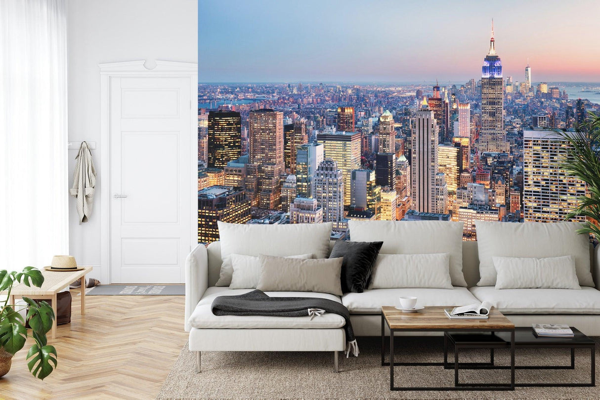New York skyline wallpaper creates stunning backdrop in modern living room with grey sofa and minimal decor