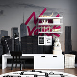New York skyline wallpaper with pink graffiti creating a bold statement in a modern living room