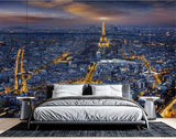 Paris night skyline wallpaper creating depth in modern living room, Eiffel Tower glowing against dark blue sky