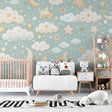 Cloud and star wallpaper in a cozy nursery with white crib, showing the perfect blend of mint green and golden stars