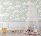 Celestial nursery wallpaper creating a magical atmosphere in a reading corner with rocking chair