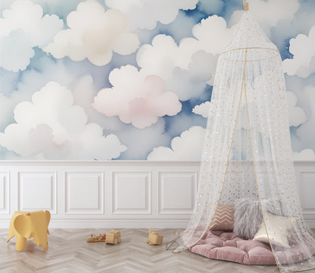 Cloud mural wallpaper bringing calm to a modern nursery with soft pink and blue tones