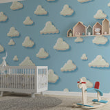 Cloud mural wallpaper creating a peaceful atmosphere in a modern nursery with white furniture