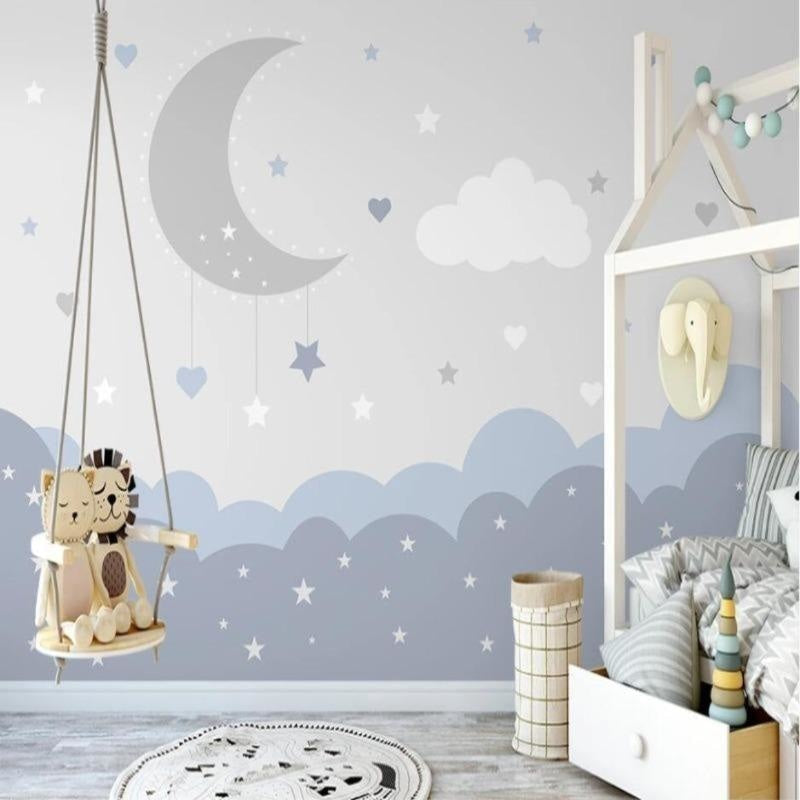 Cloud nursery wallpaper with moon and stars bringing calm to a modern nursery with white furniture