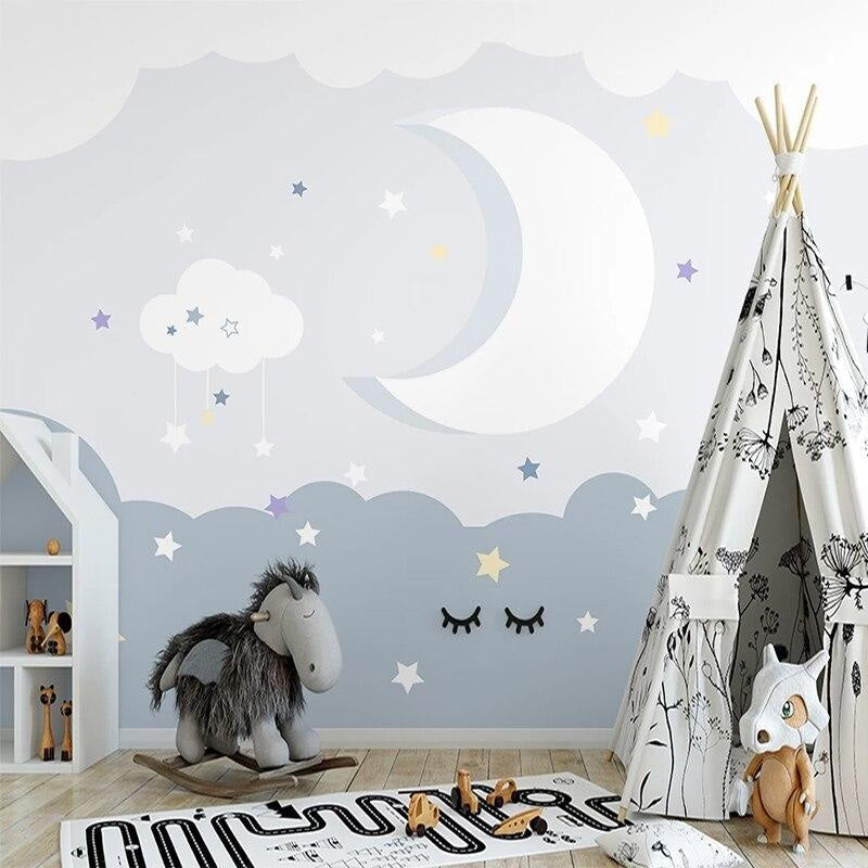 Night sky cloud wallpaper creating a cozy atmosphere in a modern nursery with soft lighting