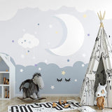 Night sky cloud wallpaper creating a cozy atmosphere in a modern nursery with soft lighting