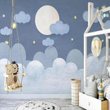 Dreamy night sky wallpaper creating a peaceful atmosphere in a modern nursery with soft lighting and gentle moon glow