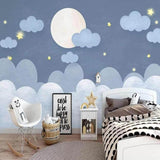 Cloud mural wallpaper transforming a child's bedroom into a magical night sky sanctuary with stars and moon