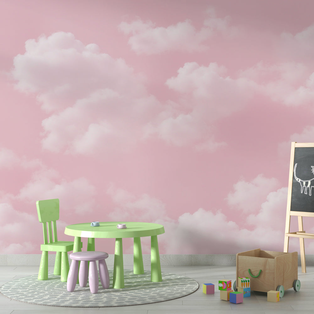 Pink cloud wallpaper mural creating a soft, dreamy atmosphere in a modern bedroom with white furniture
