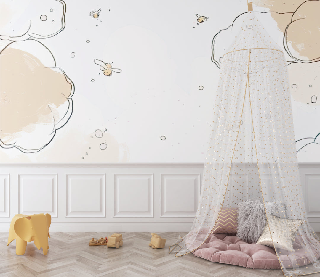 Nursery cloud wallpaper with bees in a minimalist playroom setting