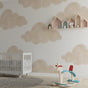 Cloud nursery wallpaper creating a soft atmosphere in a modern baby room with wooden crib