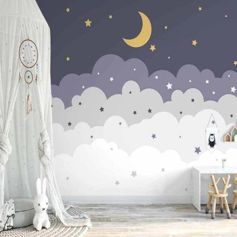 Cloud wallpaper mural with stars and moon creating a cozy atmosphere in a modern nursery with white furniture