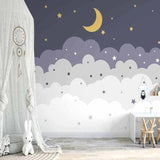 Cloud wallpaper mural with stars and moon creating a cozy atmosphere in a modern nursery with white furniture