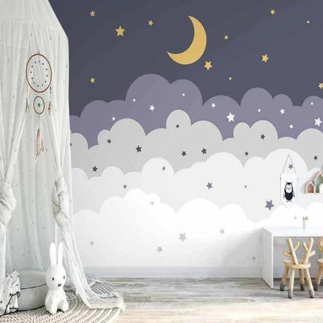 Cloud wallpaper mural with stars and moon creating a cozy atmosphere in a modern nursery with white furniture