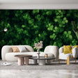 Green clover leaf wallpaper creating a fresh botanical atmosphere in a modern living room with natural light