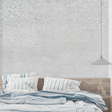 Grey concrete wallpaper creating industrial office backdrop with modern furniture