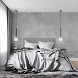 Grey concrete effect wall mural in modern home office space with clean lines