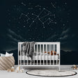 Constellation wallpaper with mountain silhouettes creating a cozy atmosphere in a modern bedroom with soft lighting