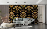 Black and gold damask wallpaper in modern living room creating elegant atmosphere