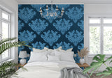 Blue damask wallpaper in a bright living room setting with modern furniture and natural light