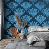 Navy damask wallpaper creating elegance in a dining room space