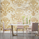 Gold and beige damask wallpaper bringing warmth to a living room setting