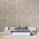 Damask wallpaper feature wall in home office with gold accents
