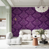 Living room accent wall with purple baroque pattern damask wallpaper
