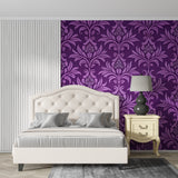 Home office space with purple damask wallpaper creating professional atmosphere