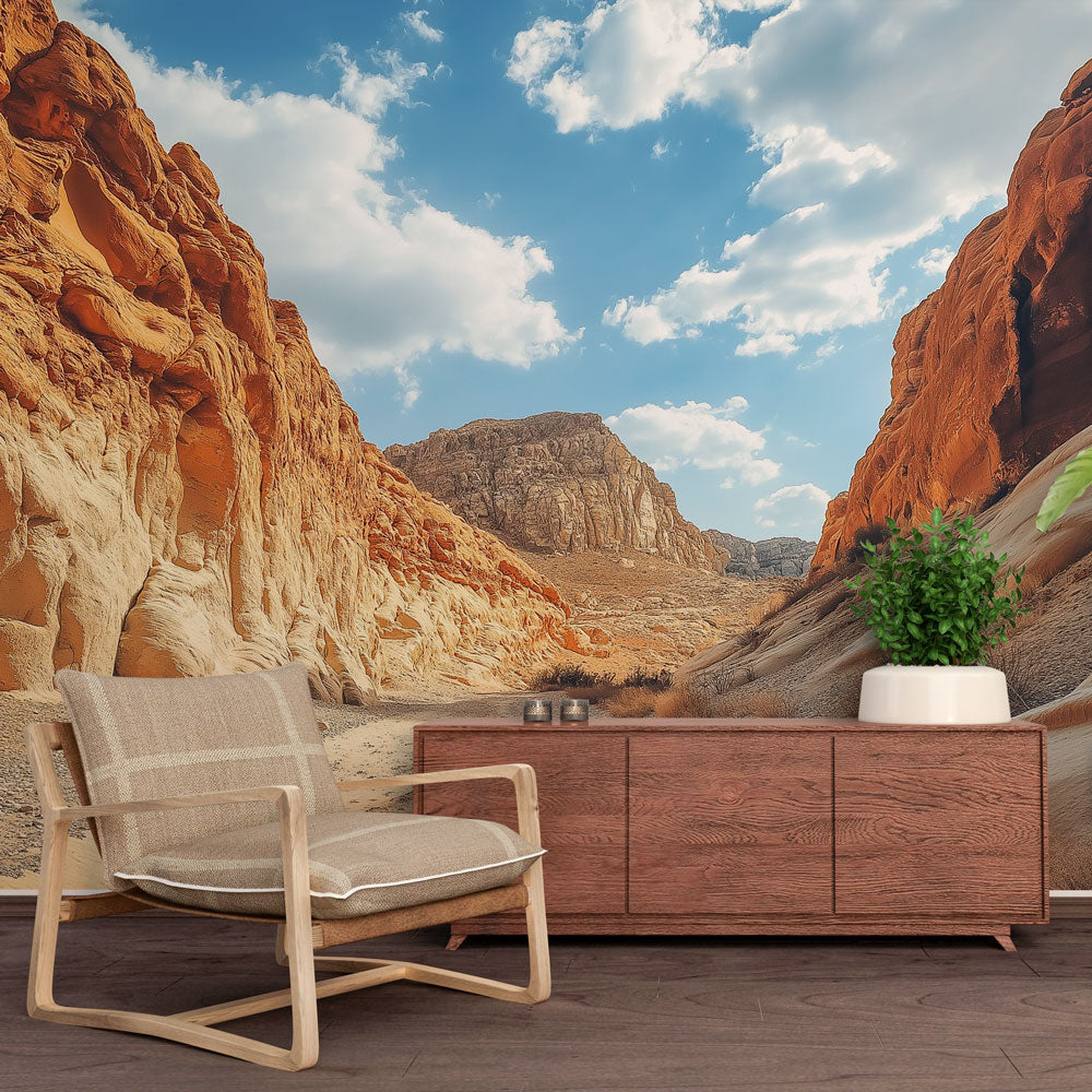 Desert canyon wall mural in modern living room, showing dramatic rock formations against blue sky creating depth and warmth