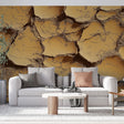 Desert landscape wallpaper with cracked earth pattern creating depth in modern living room with minimal furniture