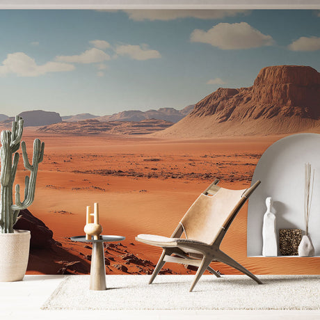 Desert landscape wallpaper creating a striking focal point in a modern living room with minimal furniture