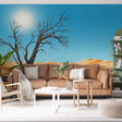 Desert tree wall mural styled in modern minimalist living room with neutral furniture and natural light