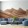 Desert rock formation wallpaper creating a stunning accent wall in a modern living room with minimalist furniture