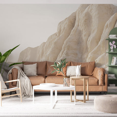 Desert landscape wallpaper creating a calming atmosphere in a modern living room with natural stone formations in warm beige tones