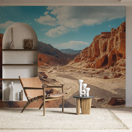 Desert canyon wallpaper mural creating dramatic impact in modern living room with neutral furniture
