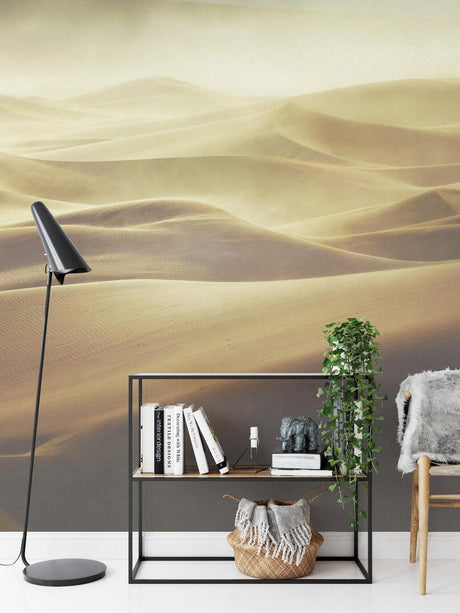 Desert landscape wallpaper creating a calm atmosphere in a modern living room with minimal furniture