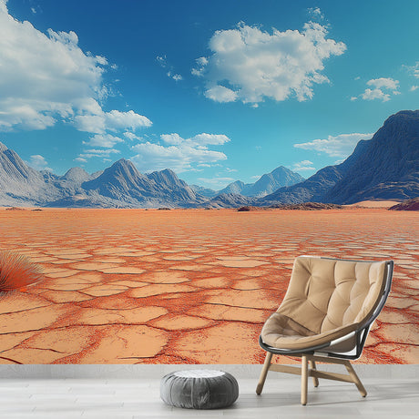 Desert landscape mural wallpaper shown in modern living room with minimal furniture, highlighting the terracotta mountains vista