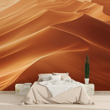 Desert mural wallpaper creating a striking focal point in a minimal modern living room with natural light