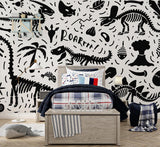 Black and white dinosaur skeleton wallpaper creating an educational atmosphere in a modern playroom