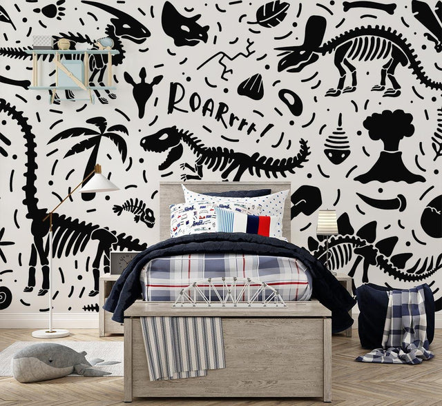 Black and white dinosaur skeleton wallpaper creating an educational atmosphere in a modern playroom