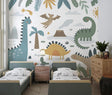 Dinosaur wall mural bringing joy to a bright nursery with white furniture and natural light