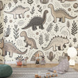 Modern hand-drawn dinosaur wallpaper creating a cozy atmosphere in a bright Scandinavian nursery with natural wood furniture