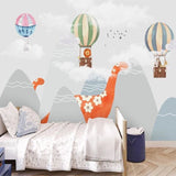Kids adventure wallpaper featuring friendly dinosaurs and hot air balloons brightens up a cozy reading nook