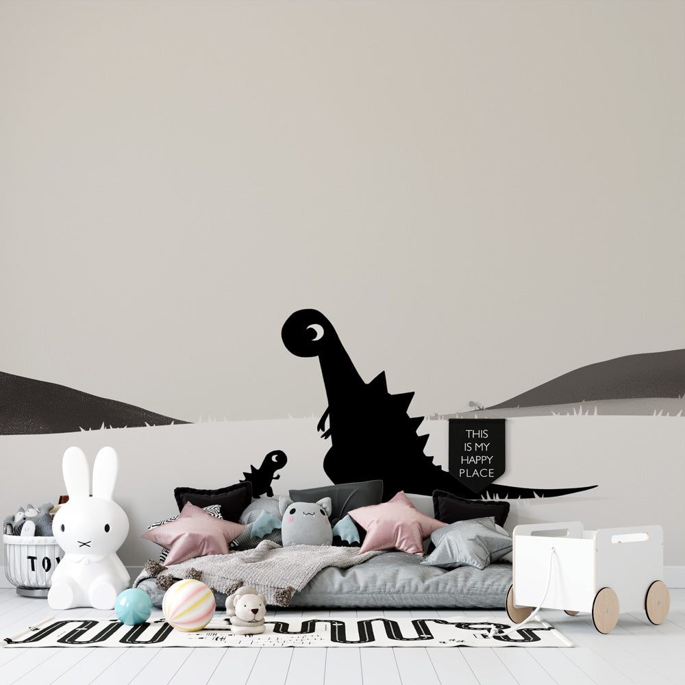 Modern black and white dinosaur wallpaper creating a peaceful atmosphere in a minimalist nursery with natural light