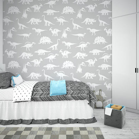 Modern grey dinosaur wallpaper bringing prehistoric charm to a bright kids bedroom with white furniture