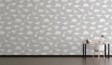 Grey and white dinosaur mural creating a fun learning space in a modern playroom setting