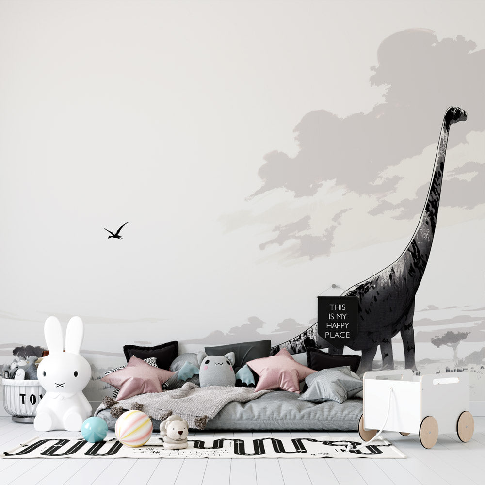 Black and white dinosaur wallpaper mural in modern nursery, showing diplodocus silhouette against peaceful savanna backdrop