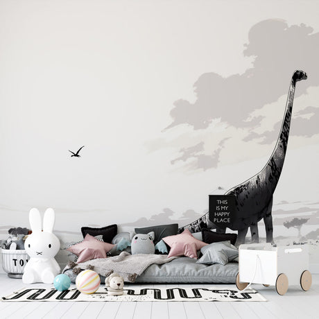 Black and white dinosaur wallpaper mural in modern nursery, showing diplodocus silhouette against peaceful savanna backdrop