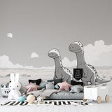 Modern black and white dinosaur mural wallpaper showcased in a bright minimalist children's bedroom with white furniture